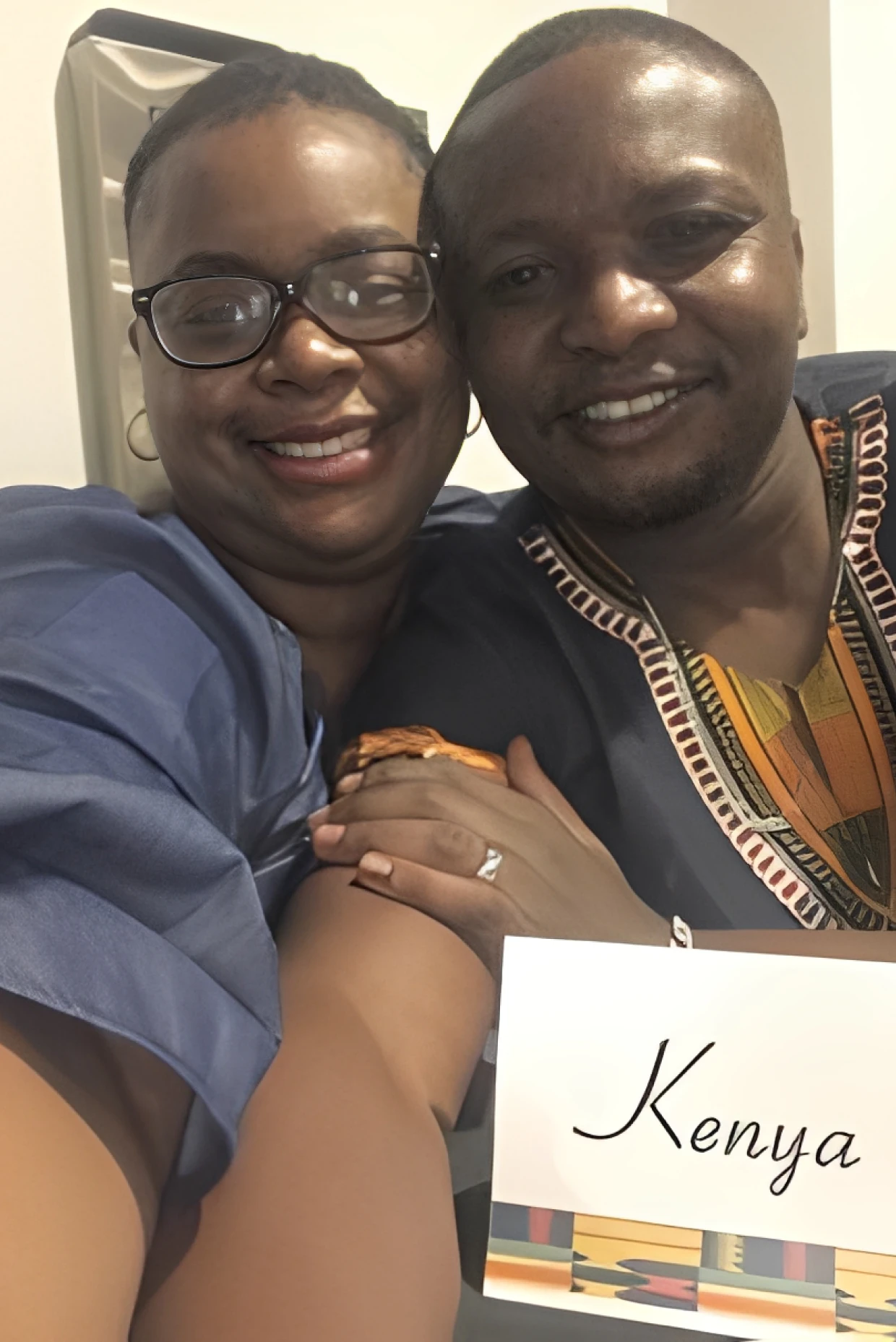 Two people posing with Kenya label